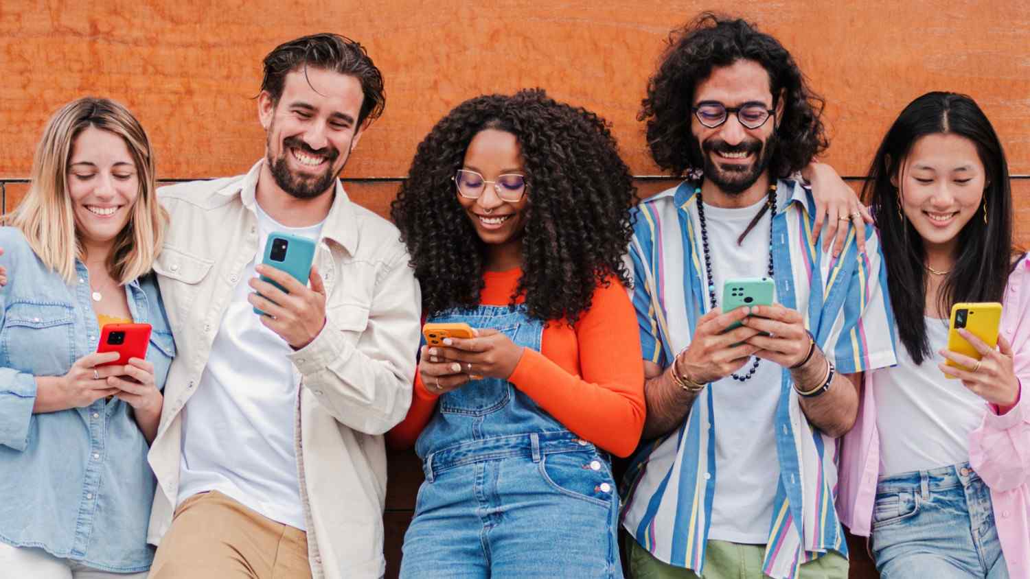 Diverse group of people using mobile phones